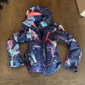 Roxy interesting design ski snowboard Jacket coat. Tons of pockets and logos!!!!